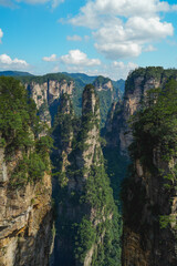 Zhangjiajie national forest park, China, Glass bridge of Zhangjiajie China Tianzishan with blue sky, concept of world heritage, avatar, heritage peak or cliff mountain, tourist attraction famous place