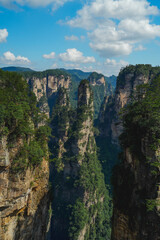 Zhangjiajie national forest park, China, Glass bridge of Zhangjiajie China Tianzishan with blue sky, concept of world heritage, avatar, heritage peak or cliff mountain, tourist attraction famous place