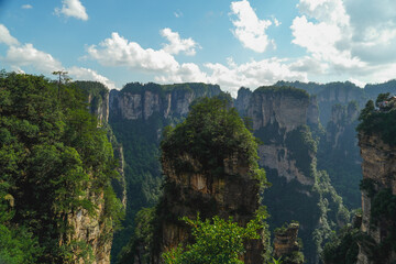 Zhangjiajie national forest park, China, Glass bridge of Zhangjiajie China Tianzishan with blue sky, concept of world heritage, avatar, heritage peak or cliff mountain, tourist attraction famous place