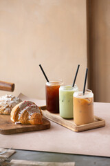 selection of iced coffee and matcha drink on a coffee shop table. Minimalist concept.