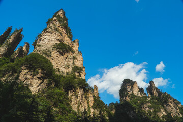Zhangjiajie national forest park, China, Glass bridge of Zhangjiajie China Tianzishan with blue sky, concept of world heritage, avatar, heritage peak or cliff mountain, tourist attraction famous place