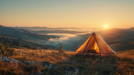 Tent on a hillside with a beautiful sunrise view