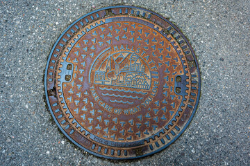 Manhole cover with pattern in Hallstatt, Austria.