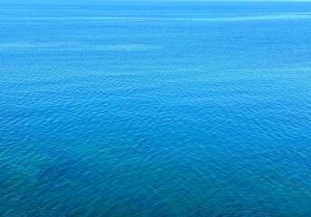 Blue calm ocean water background 
