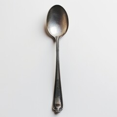 A silver spoon on a white background