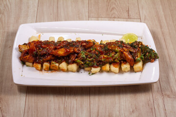 paneer fingers oriental sauce isolated on wooden background