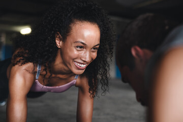 Fitness, couple and pushup for exercise outdoor, muscle development and balance support of...