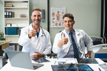 Medical doctor caucasian, successful medical team thumbs up to show success and motivation. Health care.