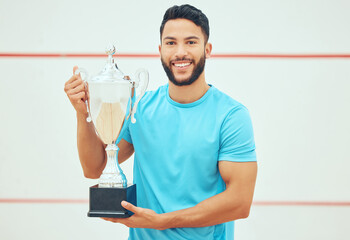 Sports man, portrait smile and trophy for winning competition, challenge and success indoor court....