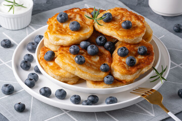Homemade mini pancakes with blueberries