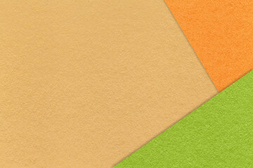 Texture craft yellow paper background with orange and green border. Vintage abstract ocher...