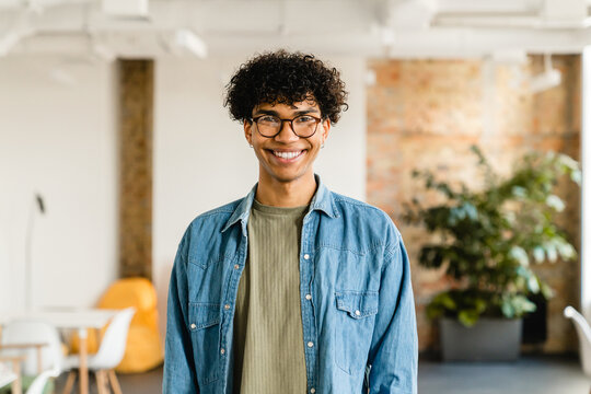 Cropped portrait of an african young businessman freelancer it worker designer programist student working remote distant studding in loft casual cafe coworking. College education concept