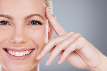 Touch, skincare and portrait of woman in studio for cosmetics, wellness and facial treatment....