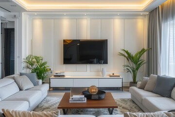 Fototapeta premium Stylish modern living room with sleek furniture, a large TV, and lush plants, creating a cozy yet elegant atmosphere.
