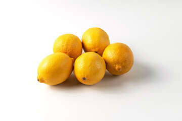 Ripe lemons on a white background