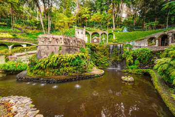Monte Palace, Tropical Garden with Waterfalls, Lakes and traditional buildings above the city of...