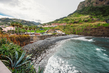 Madeira island nature scenery. View of Porto da Cruz village mountains landscape and ocean pool.
