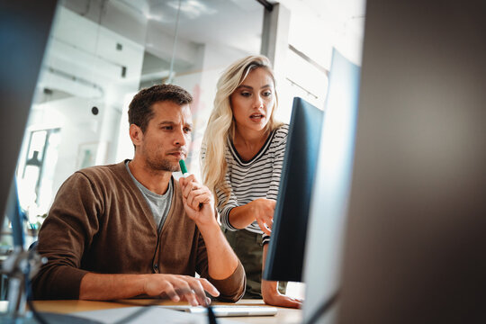 Business solutions, technology and strategy concept. Colleagues working and brainstorming in office