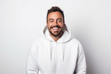 Obraz premium Portrait of a joyful man in his 30s wearing a zip-up fleece hoodie isolated on white background