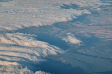 Naklejka premium Views of clouds and clearings from a plane Madrid - Paris