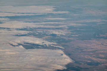 Views of clouds and clearings from a plane Madrid - Paris