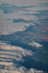 Views of clouds and clearings from a plane Madrid - Paris