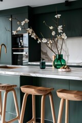 modern kitchen with wooden stools and vase with white blooming flowers