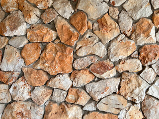 Background of stone  texture. Wall made of natural stones of different sizes