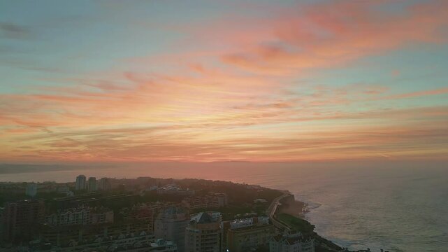 Sunset horizon resort city placed on amazing waterfront. Golden sky over town