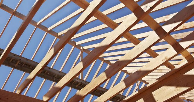 During construction of new home, wooden frame beams are used to construct framing in walls