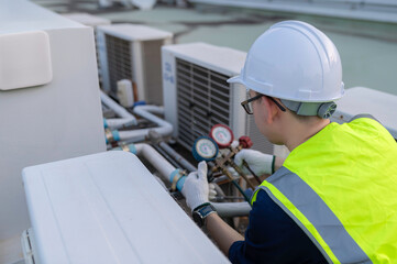 Refrigeration and Air Conditioning Engineering Detects Plant Cooling Problems,electrician maintenance Condensing on the rooftop outdoors of large industrial building,engineer under checking the indust