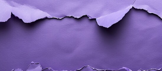 Top-down view of a textured purple paper background, providing ample space for text or images.