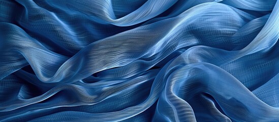 Silk organza in blue with wavy border and open weave creates a textured wave background for a copy space image.