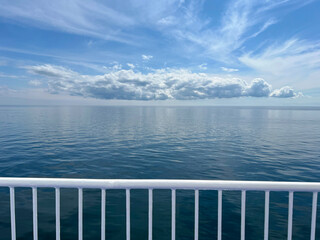 Sea view from the deck of a cruise ferry ship. Calm water without waves