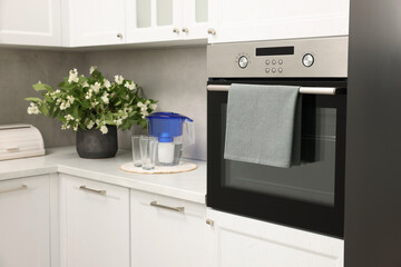 Electric oven with towel in kitchen. Cooking appliance