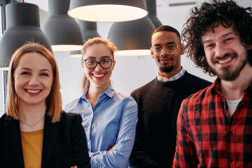 Obraz premium Diverse Business Team Standing United in Modern Office Ready for New Challenges.
