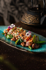 Vegetarian sushi with mushrooms and salad. Seeds and flowers on top. Asian food. 