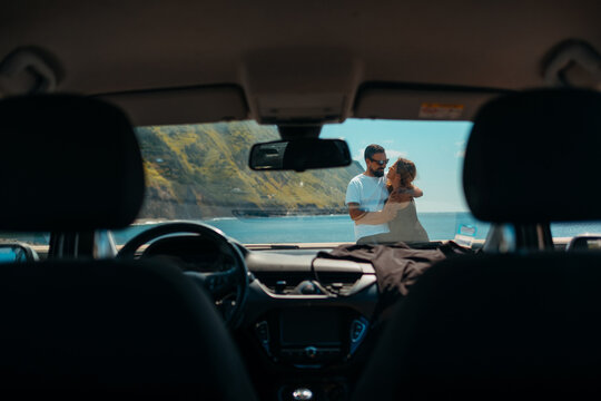 Intimate moment shared by a couple by the ocean in Sao Miguel.