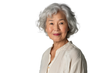 Smiling senior Asian woman wearing a light-colored blouse, looking at camera, isolated on white background