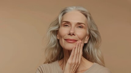 beauty portrait of a smiling woman 60 years old with gray hair on a  neutral background, concept of natural female beauty and skin care, copy space