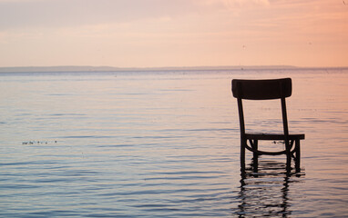 A retro chair in the water