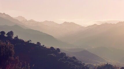 Fototapeta premium Mountain Range Silhouetted Against a Pink Sunset Sky