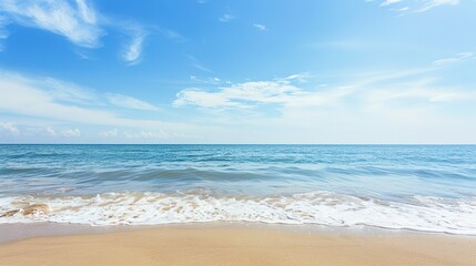 A Blue Sky Day at the Beach With White Clouds and a Sandy Shore