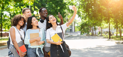 Student's Selfie. Group of university friends taking self-portrait on smartphone outdoors and...