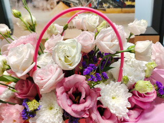 Arranged flower basket with various flowers as a holiday gift close-up