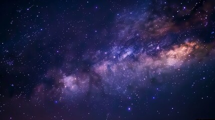 Naklejka premium A clear night sky sparkles with stars, while the Milky Way stretches like a luminous river.