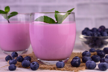 Smoothie with fresh blueberries in glasses.Close-up.
