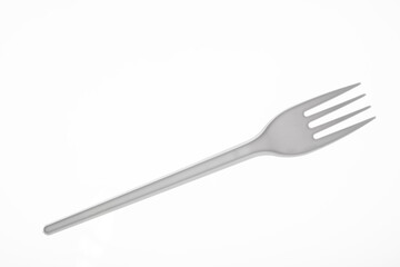 Disposable fork. Plastic fork. Disposable tableware.
