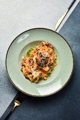 Traditional Bolognese pasta with meat and tomato paste. In a plate. Restaurant dish. Close up.
