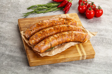 Raw sausages with spices and herbs